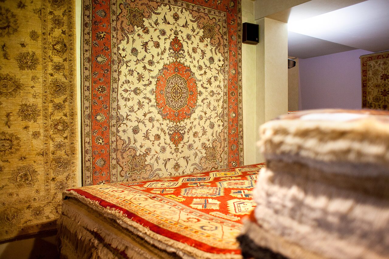 Detail of rugs stacked in the Baroncelli showroom